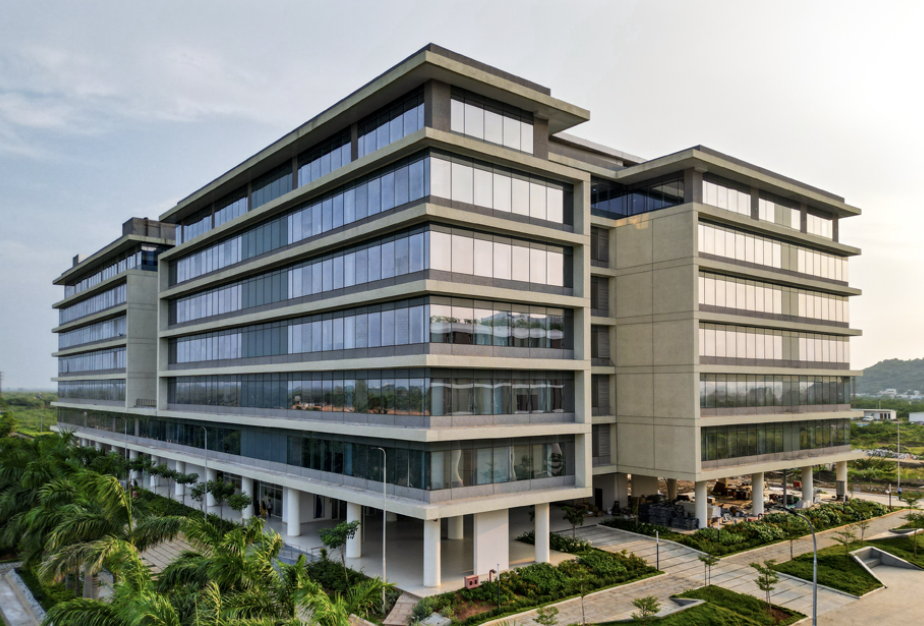 A modern university building with many glass windows.
